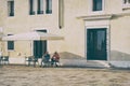 Senior tourist couple at an outdoor restaurant cafe in Venice.. Picturesque idyllic scene