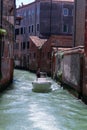 Venice Italy. May 20, 2016. A small boat navigates the canals of the city without streets Royalty Free Stock Photo