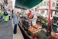 Vendors sell goods on floating market boat, Venice, Italy Royalty Free Stock Photo