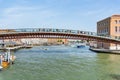Tourists walking on Constitution Bridge (Ponte della Costituzione) in Venice