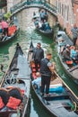 Venice, Italy - May 25, 2019: view of gondolas traffic in canal singer at boat