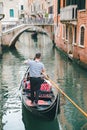 Venice, Italy - May 25, 2019: view of gondolas traffic in canal singer at boat Royalty Free Stock Photo