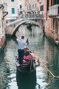 Venice, Italy - May 25, 2019: view of gondolas traffic in canal singer at boat Royalty Free Stock Photo