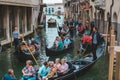 Venice, Italy - May 25, 2019: view of gondolas traffic in canal singer at boat