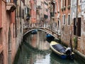 Venice, Italy - 22 May 2105: View of a side canal and old buildings in the centre of Venice.