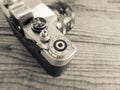 VENICE, ITALY - MAY 13, 2017: A Zenit EM is a vintage film camera made in URSS, lying over a dated wooden background Royalty Free Stock Photo