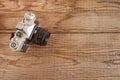 VENICE, ITALY - MAY 13, 2017: A Zenit EM is a vintage film camera made in URSS, lying over a dated wooden background