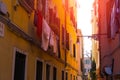 Venice Italy morning sunny street with laundry washed clothes hanging out to dry on ropes