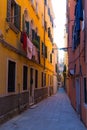 Venice Italy morning sunny street with laundry washed clothes hanging out to dry on ropes Royalty Free Stock Photo