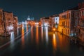 Venice, Italy night scenery of Grand Canal. Vivid light trails of ferries and boats reflected on water surface. Majestic Royalty Free Stock Photo