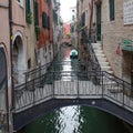 Venice, Italy - 14 Nov, 2022: Colourful backstreet canals of the Venetian Lagoon