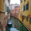 Venice, Italy - 14 Nov, 2022: Colourful backstreet canals of the Venetian Lagoon Royalty Free Stock Photo