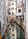 Venice, Italy - 14 Nov, 2022: Reflections on a backstreet canal in San Marco Royalty Free Stock Photo