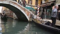 Classic venetian canal or channel street with riding gondolas