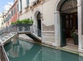 Forged metal bridge over a canal in Venya. Venice is one of the most popular tourist