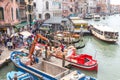 VENICE, ITALY - NOVEMBER 23, 2015: two men are unloading sacks from the boat in Venice, Italy Royalty Free Stock Photo