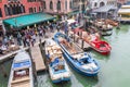 VENICE, ITALY - NOVEMBER 23, 2015: two men are unloading sacks from the boat in Venice, Italy Royalty Free Stock Photo