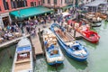VENICE, ITALY - NOVEMBER 23, 2015: two men are unloading sacks from the boat in Venice, Italy Royalty Free Stock Photo