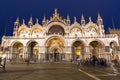 Venice, Italy - October 24, 2019: Amazing architecture of Saint Mark Basilica with tourists in Venice city at night, Italy Royalty Free Stock Photo