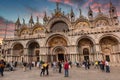 Venice, Italy - October 24, 2019: Amazing architecture of Saint Mark Basilica with tourists in Venice city at sunset, Italy Royalty Free Stock Photo