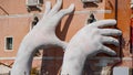 VENICE, ITALY - OCTOBER, 2017: Big Lorenzo Quinn hands support the city against climate change.