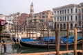 Venice, Italy - October 13, 2017: Gondolas in Venice. The gondolas are moored at the mooring posts. Royalty Free Stock Photo