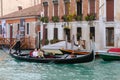 VENICE, ITALY - OCTOBER 26 : Gondolier ferrying passengers along