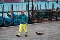 VENICE, ITALY - OCTOBER 8 , 2017: Janitor in uniform on San Marco square Royalty Free Stock Photo