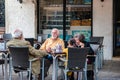 Street life in Venice. People relaxing in a street cafe