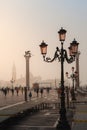 VENICE, ITALY - OCTOBER 06, 2017:  Tourits on the San Marco square at sunrise Royalty Free Stock Photo