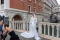 An unknown model poses in front of the Bridge of Sighs in Venice Royalty Free Stock Photo