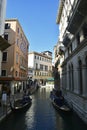 Venice, Italy, October 2021: View of a narrow canal surrounded by old brick houses in Venice. Royalty Free Stock Photo