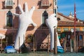 VENICE, ITALY - 07 Otober, 2017: Gigantic sculpture `Support` for the Biennale 2017. Author - Lorenzo Quinn