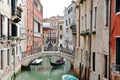 Venice, Italy - picturesque view of a canal, buildings, gondola and bridge Royalty Free Stock Photo