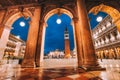 Venice, Italy. Scenic view of Piazza San Marco framed in architectural arches after dusk, blue hour Royalty Free Stock Photo