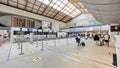 VENICE,ITALY.16 SEPTEMBER 2023.A small group lingers infront flight info board in Venice International Airport Royalty Free Stock Photo