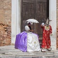 Beautiful dressed women and man in traditional Venetian costume, Venice, Italy