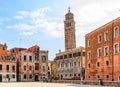 Old square with a leaning bell tower of the Chiesa di Santo Stefano church in the background in Venice Italy Royalty Free Stock Photo