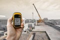 Venice, Italy - September 22, 2014: finding the right position inside a construction site via gps blurred background Royalty Free Stock Photo