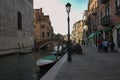 Venice, Italy: One of the many arch bridge linked to Jewish ghetto over the canal with motor boats and
