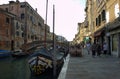 Venice, Italy: One of the many arch bridge linked to Jewish ghetto over the canal with motor boats and