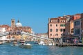 Venice, Italy - september 15, 2019: Panoramic view of the Grand Canal with vaporetto and tourists near Venice Santa Lucia station Royalty Free Stock Photo