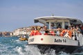 People travel aboard an ACTV public transport water bus in Venice