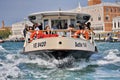 People travel aboard an ACTV public transport water bus in Venice