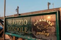 Venice, Italy, A sign in the parking lot of gondolas in front of St Mark Square at sunrise Royalty Free Stock Photo