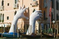 `Support` - the modern sculpture of Lorenzo Quinn close up. Venice, Italy