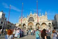 Tourists are on Piazza San Marco near famous Cathedral of St. Mark, Venice, Italy Royalty Free Stock Photo