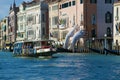 Vaporetto swims by Lorenzo Quinn`s sculpture Support on the Grand Canal, Venice