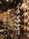 Venice, Italy, September 24, 2020. Venetian masks in a shop window, side view. Beautiful graceful bright carnival masks with price Royalty Free Stock Photo