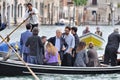 Venetians going to work in a gondola in Venice